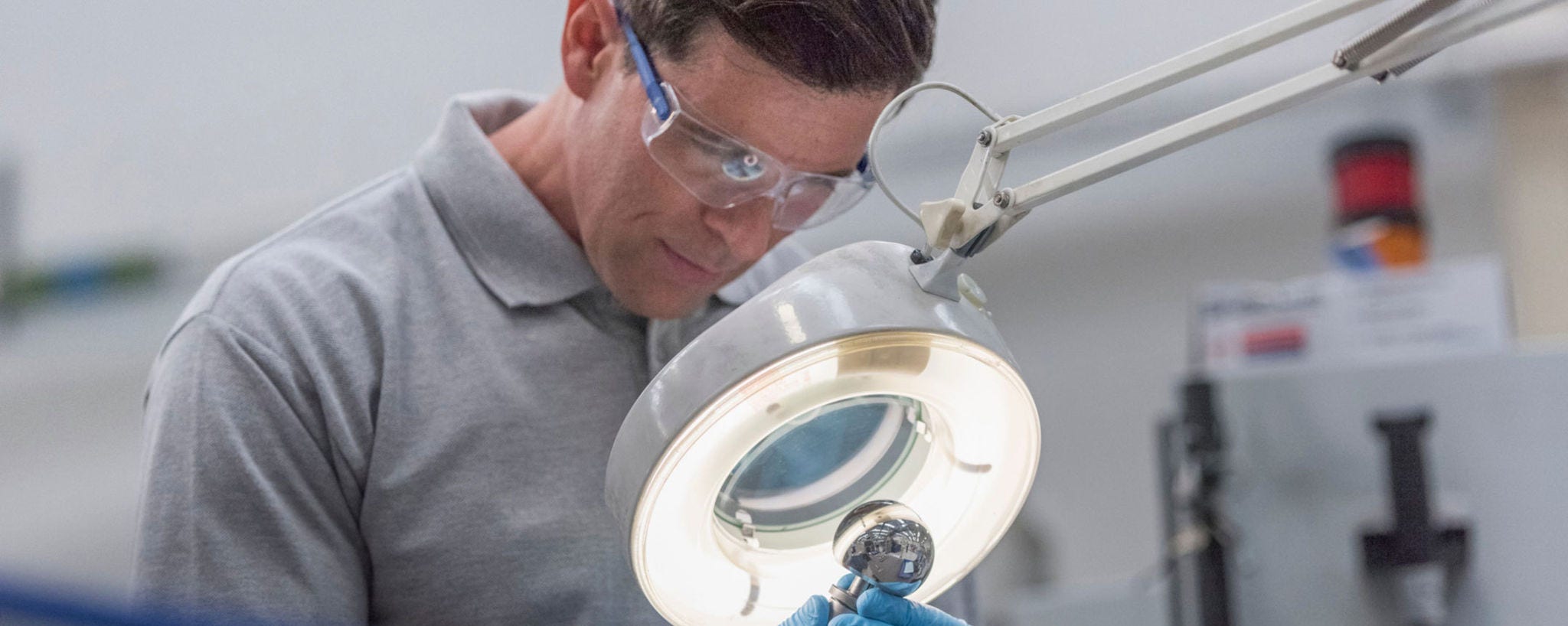 man looking at a part through a telescope