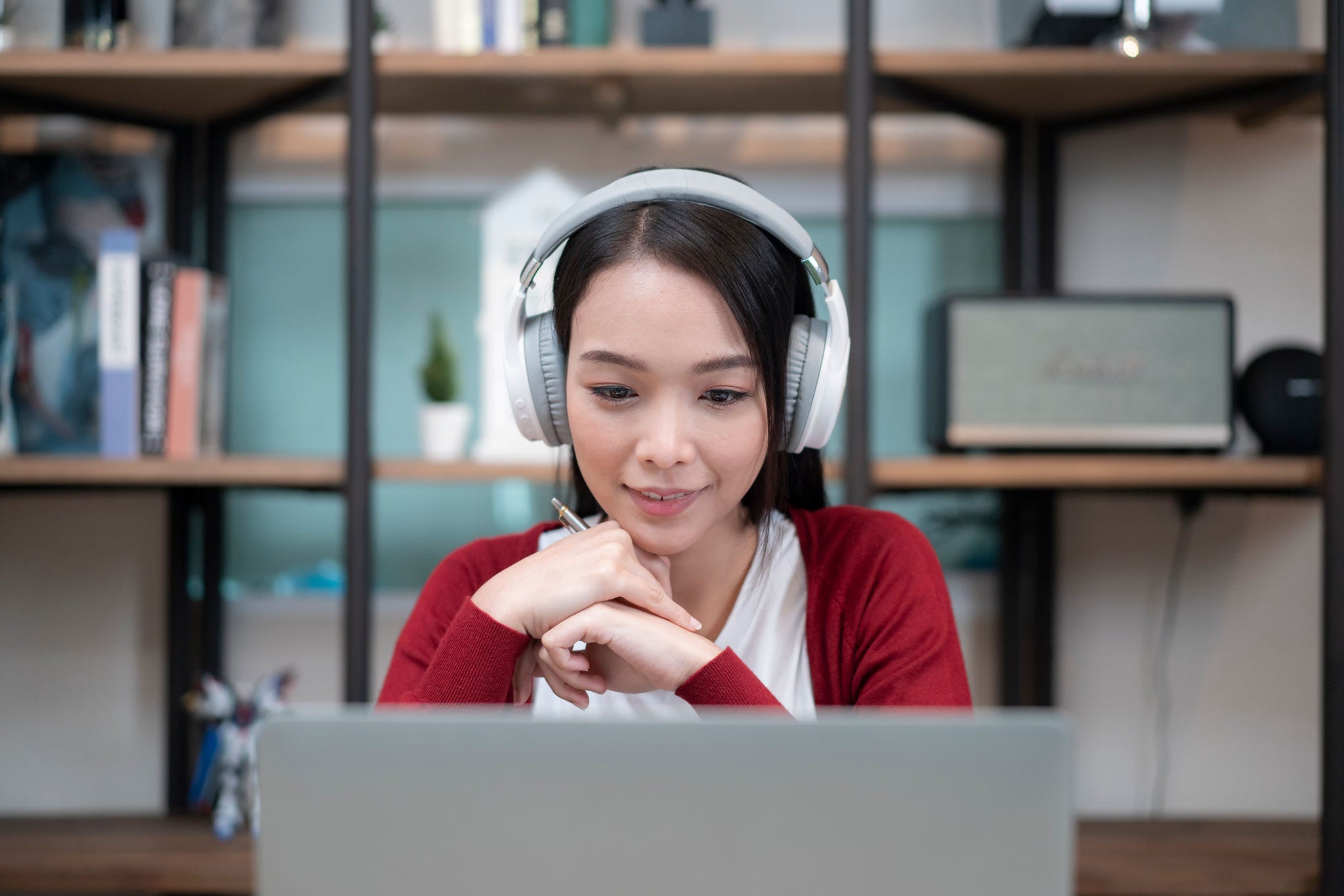 close-up shot of an attractive young businesswoman working with video conference at home