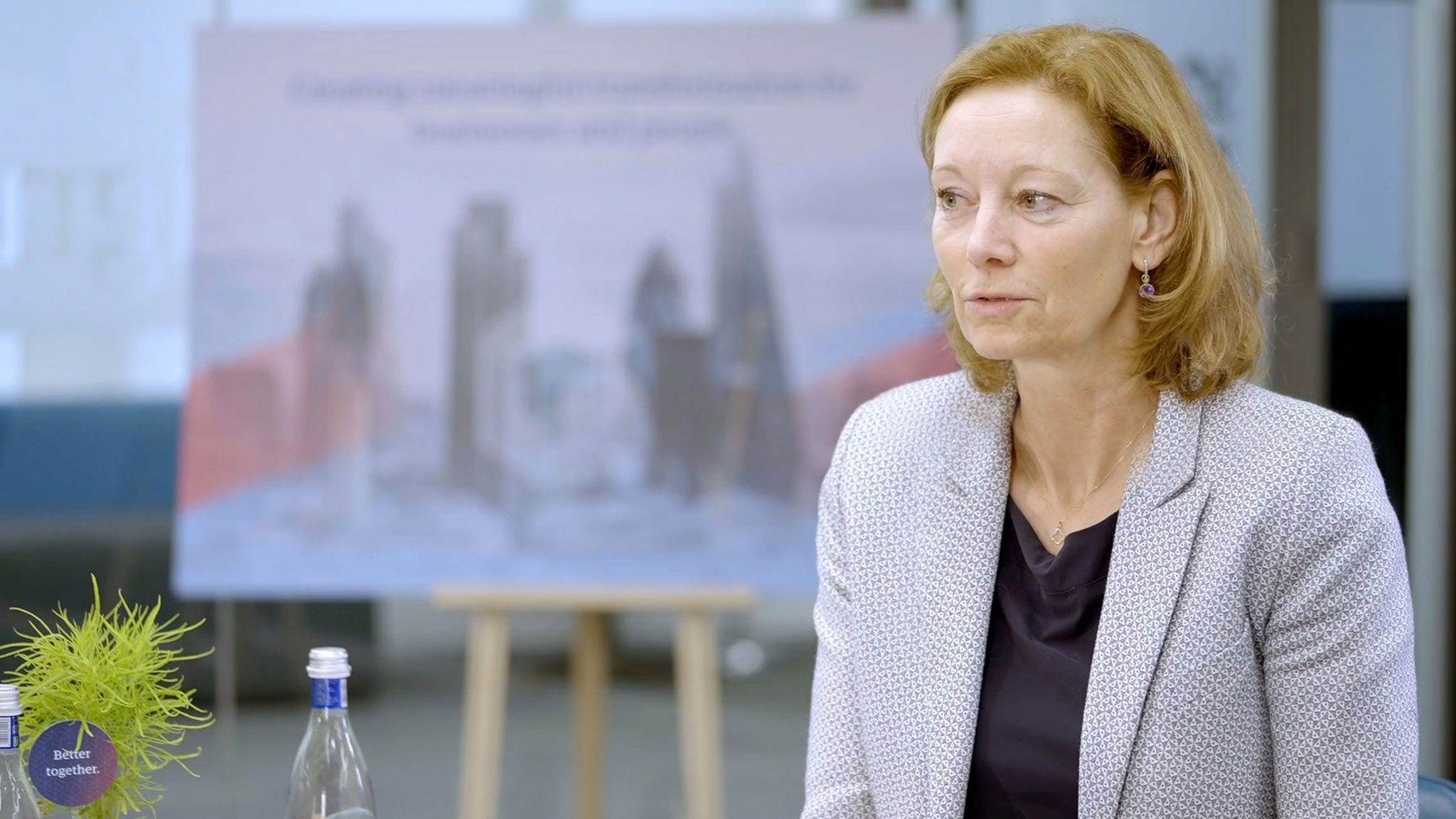 Woman standing in front of graph